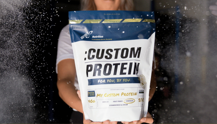 Woman holding a bag of Custom infinit protein