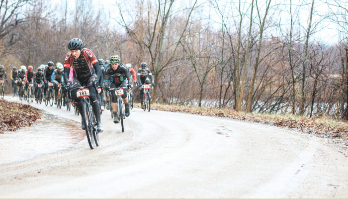 Gravel cycle group going around a turn